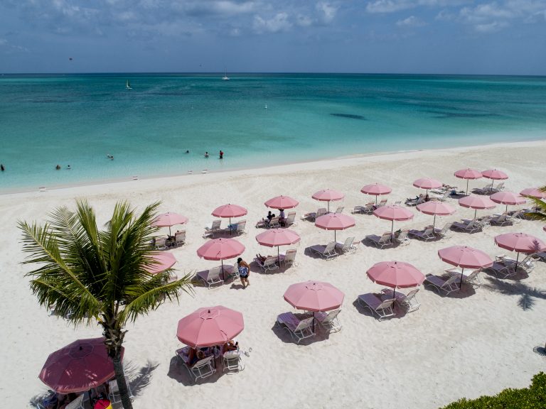 Iconic pink umbrellas on Grace Bay beach how to beat the winter blues