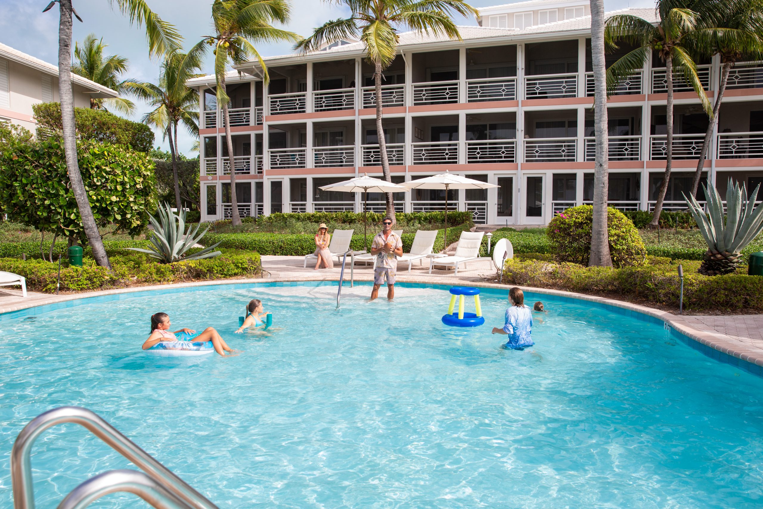 Family playing at the pool at Ocean Club Resorts